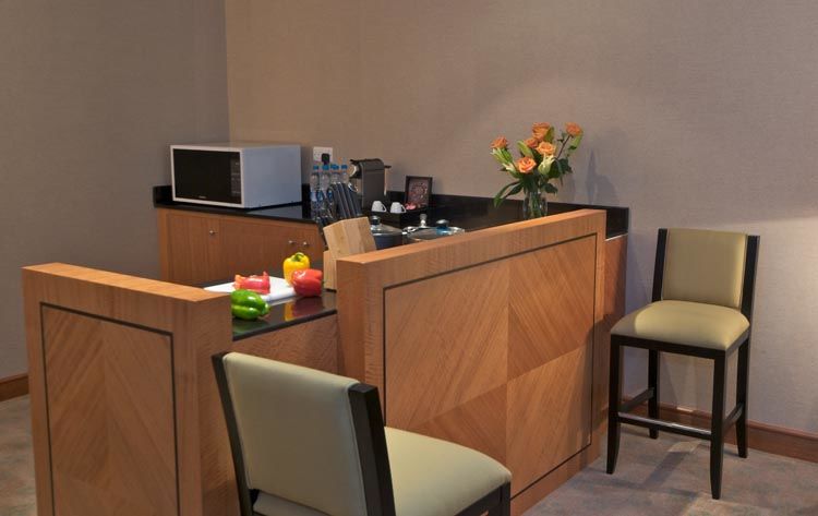 Wiseman Grand Hotel Doha Eksteriør billede A small kitchen in a hotel suite